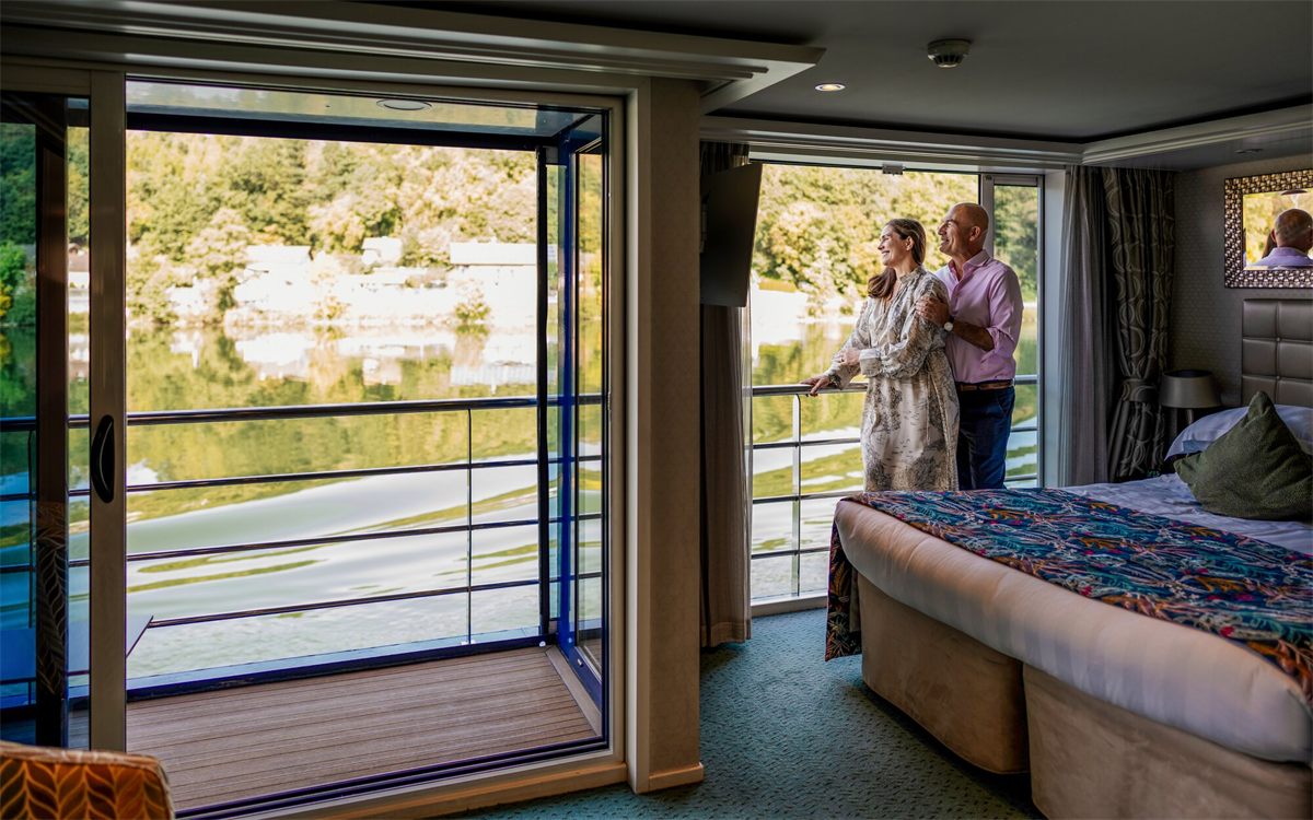A twin-balcony stateroom, French balcony open to the river