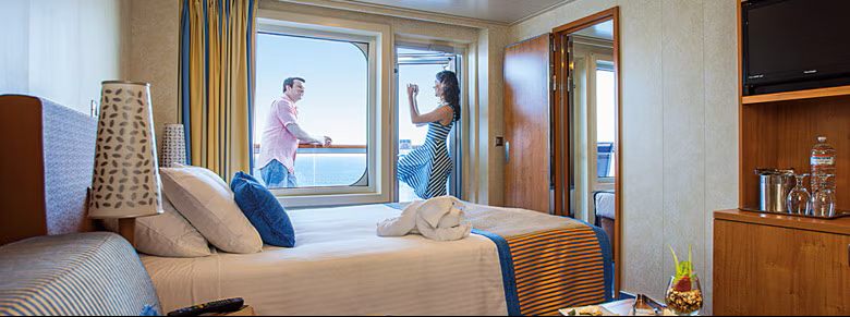 A balcony stateroom aboard Carnival