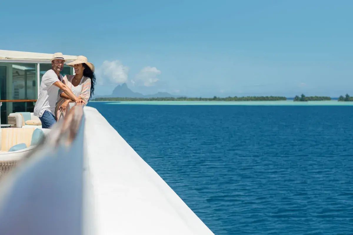 Guests on deck with Bora Bora beyond