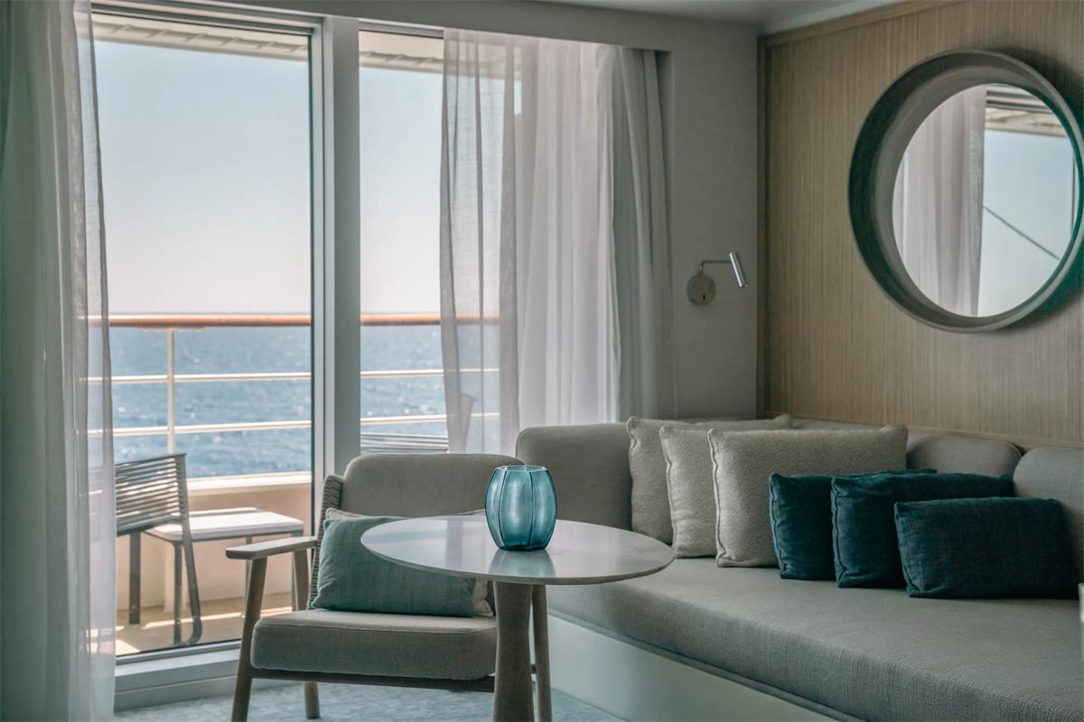 A balcony stateroom aboard a PONANT Explorer-class ship