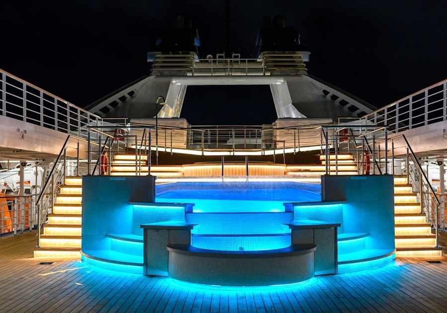 The pool deck lit up after dark on Star Breeze